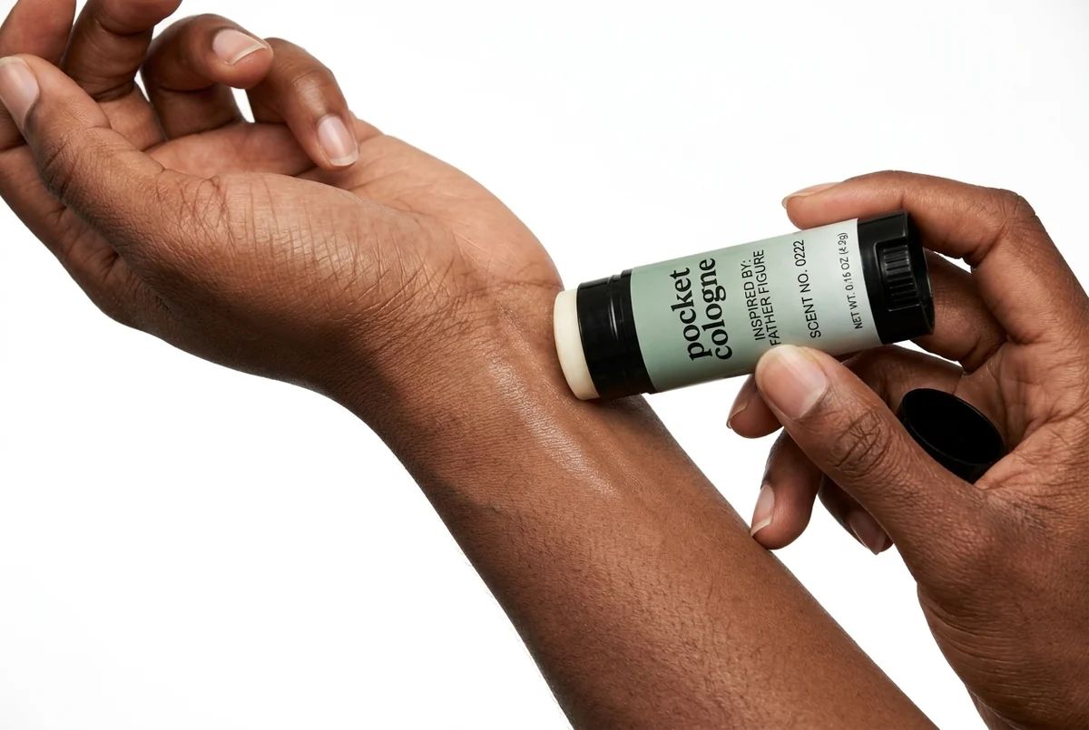 Applying Pocket Perfume Scent No. 0013, inspired by Sauvage, to the back of the hand