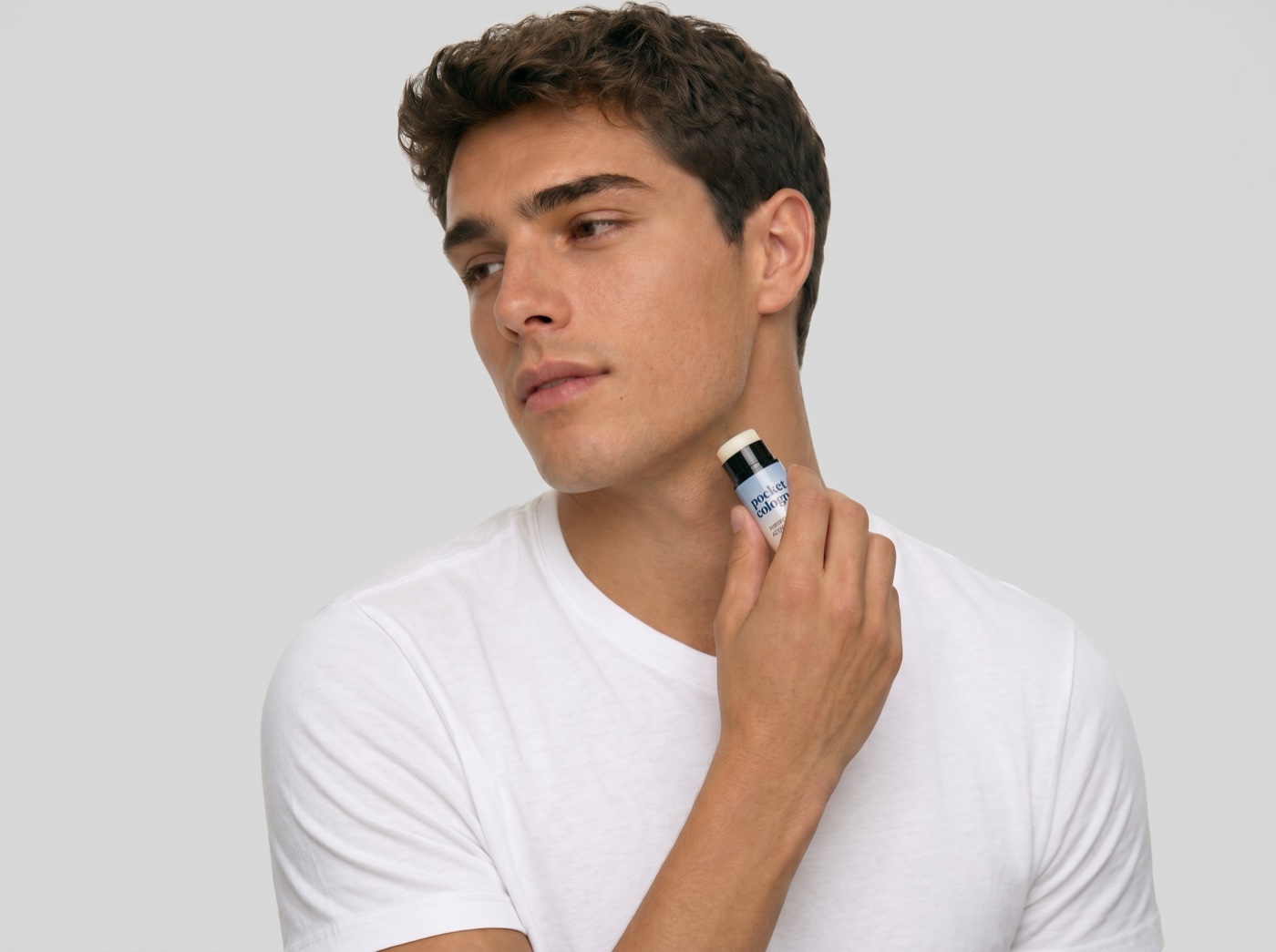 Man holding a Pocket Perfume solid fragrance